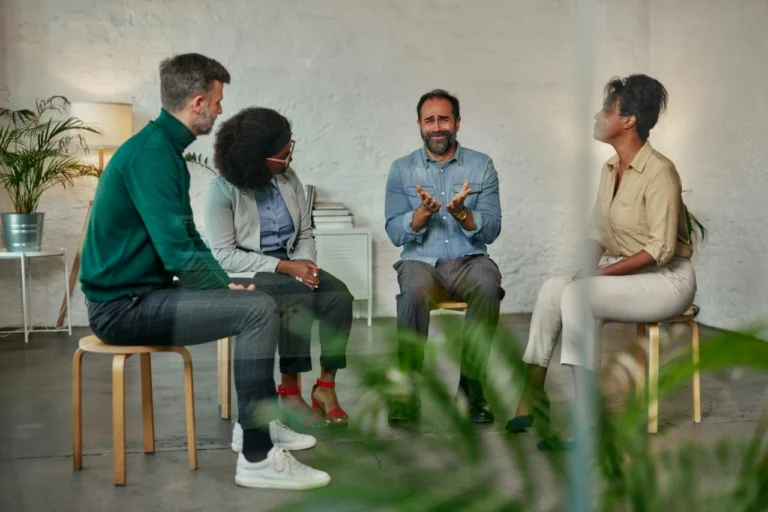 Adults talking in a support group session